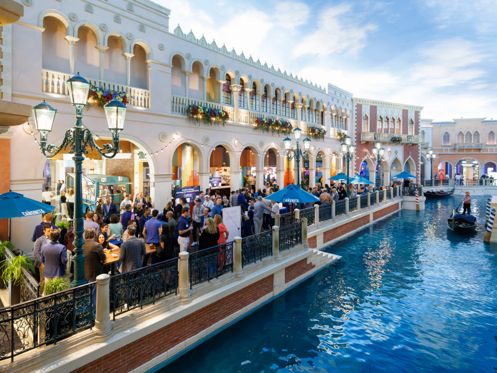 Attendees gather at Caliber’s Fin & Juice happy hour during Money20/20 USA 2025.