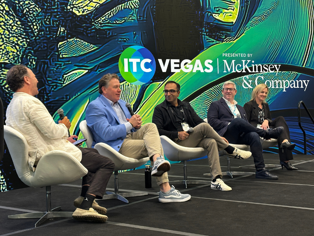 Speakers on stage at ITC Vegas 2025 during a session on insurance innovation.